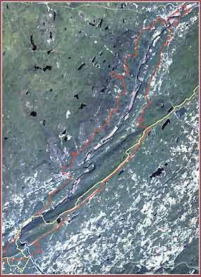 Satellite image of a river valley. Boundaries are overlaid on the image in red and yellow. Satellite image of a river valley. Boundaries are overlaid on the image in red and yellow.