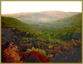 View through near mountains to a distant mountain