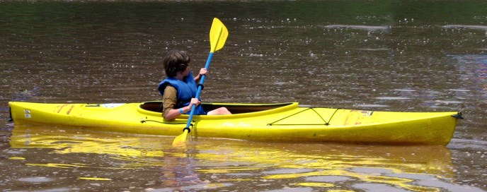 Teenager in a yellow kayaK
