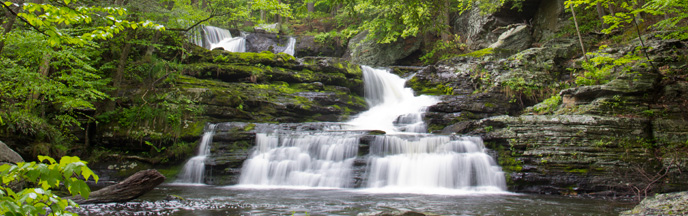 waterfall cascading over rocks waterfall cascading over rocks