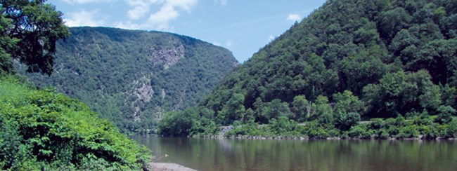 a river flowing between two mountains a river flowing between two mountains
