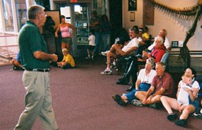 Volunteer speaking to visitors. Volunteer speaking to visitors.