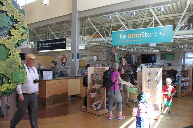 People walk through a sale area for the monument store