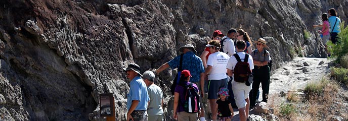 A ranger leads a group for a hike on the Fossil Discovery Trail