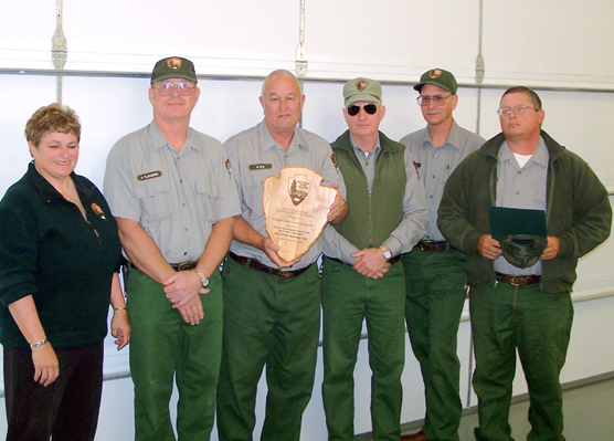 Dinosaur National Monument's Green River Maintenance Team (left to right): Mary Risser (superintendent), Dall Flanders (electrician, retired), Bill Dye (district foreman), Angell Britt (engineering equipment operator), Merlin Mott (maintenance worker), and Randy Clark (motor vehicle operator)