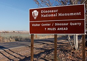 Dinosaur road sign