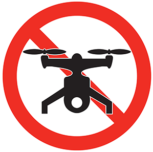 A drone with a red slash through it.