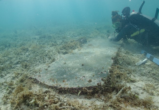 Diver-examines-underwater-headstone-of-John-Greer1