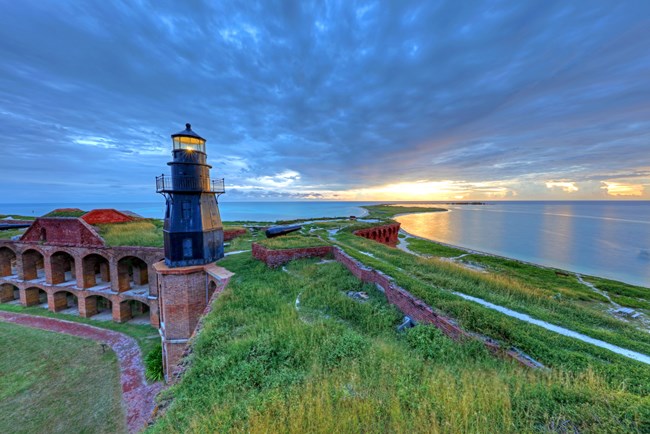 A lighthouse structure on a brick fort