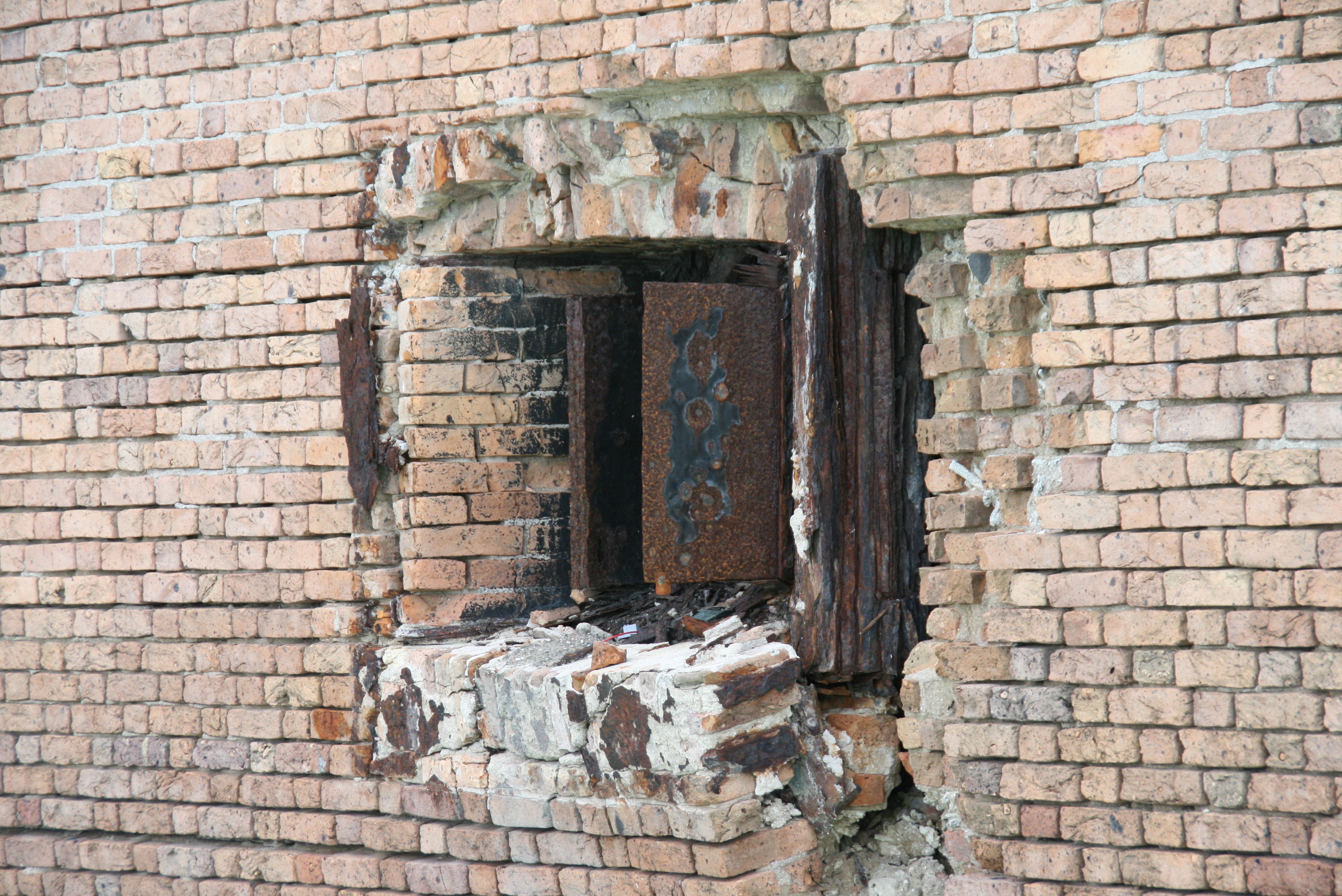 As the iron expanded, it pushed the brick apart