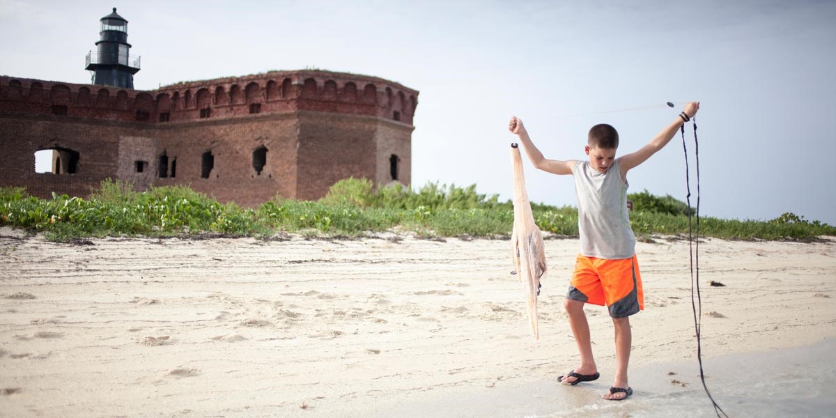 Cast Netting Child on Beach Cast Netting Child on Beach