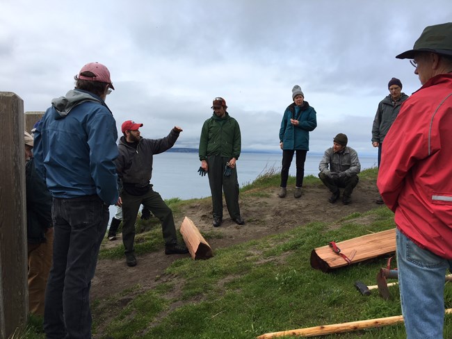 Group of people gathered for safety meeting.