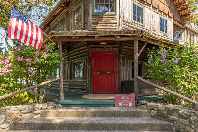 Old log inn with American Flag.
