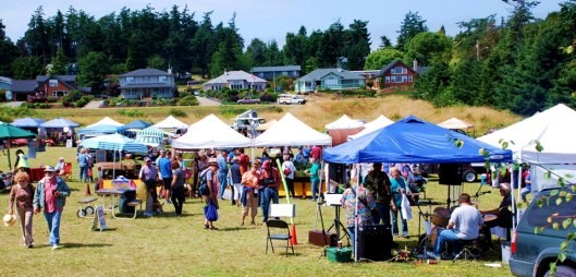 Coupeville Farmers Market People walking among tents at farmers market.