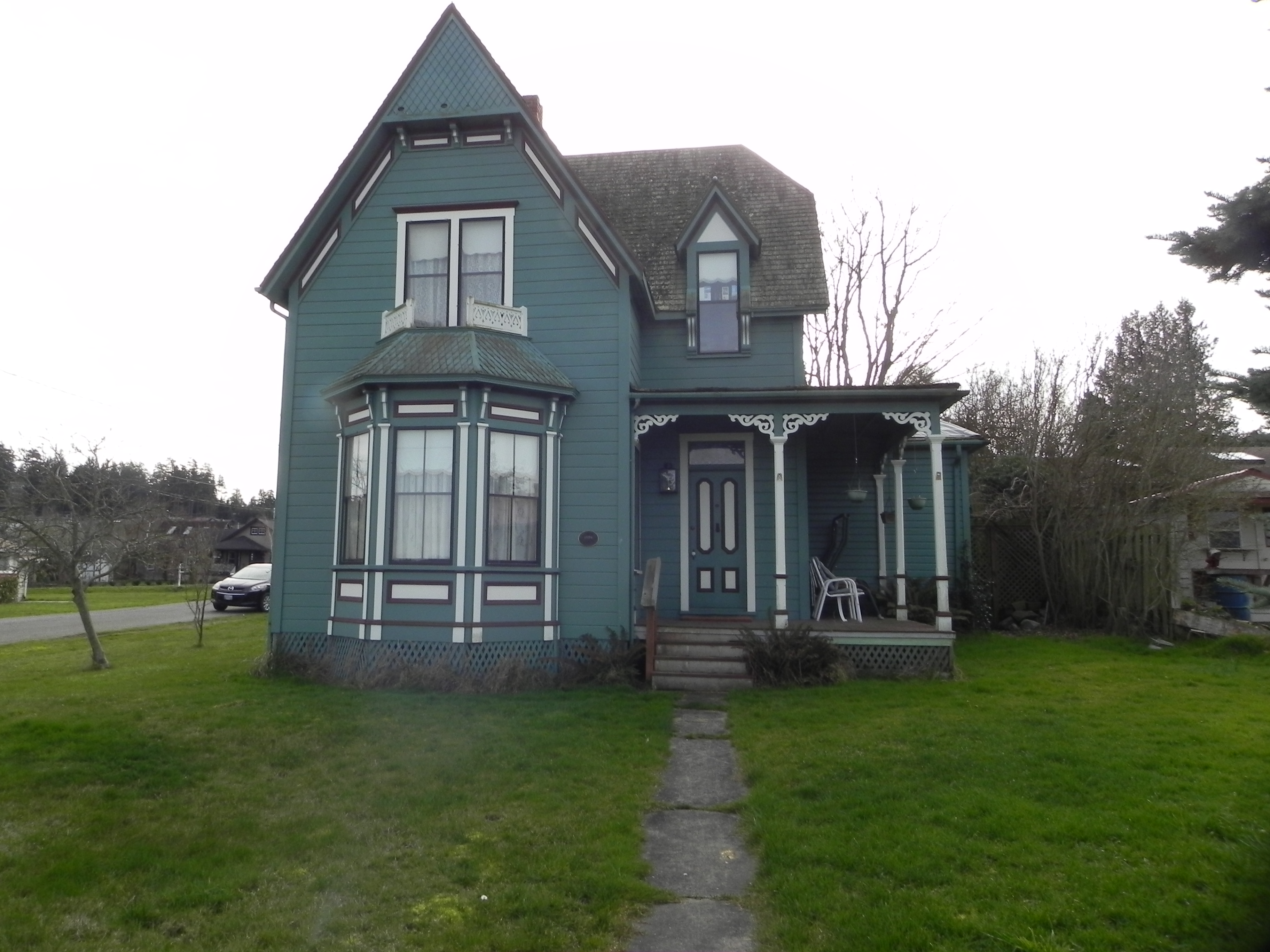 The Clapp House, a blue historic victorian house