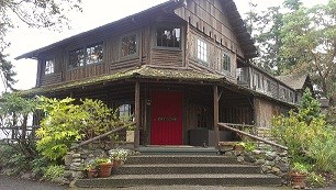 Old log inn with red door.