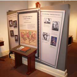Photo of 3 panels and desk highlighting Poe's influence on today's literary and culture Photo of 3 panels and desk highlighting Poe's influence on today's literary and culture