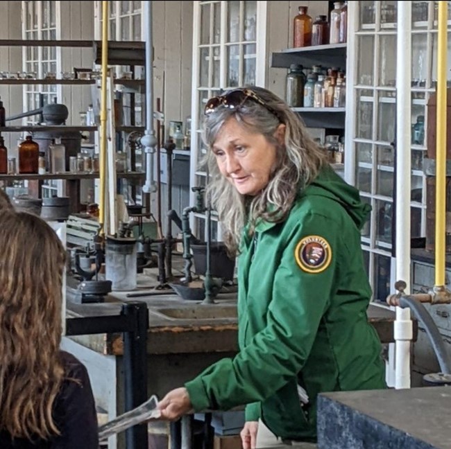 A female volunteer giving a talk in a chemistry laboratory