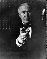 Thomas Edison holding a lightbulb.