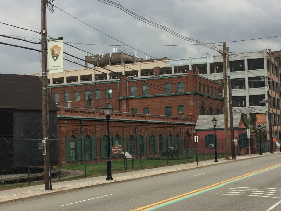 Looking down the street at the Laboratory Complex. Photo looking down the street at the laboratory complex with its red brick buildings and large cement factory buildings