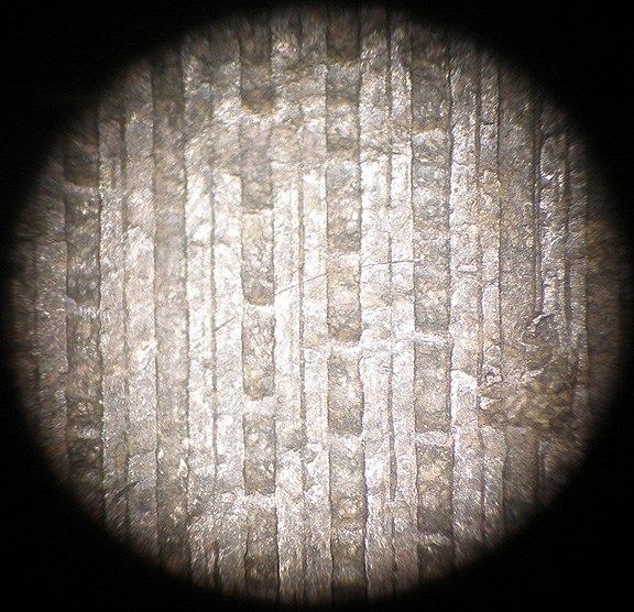 The record groove surface viewed under a microscope.