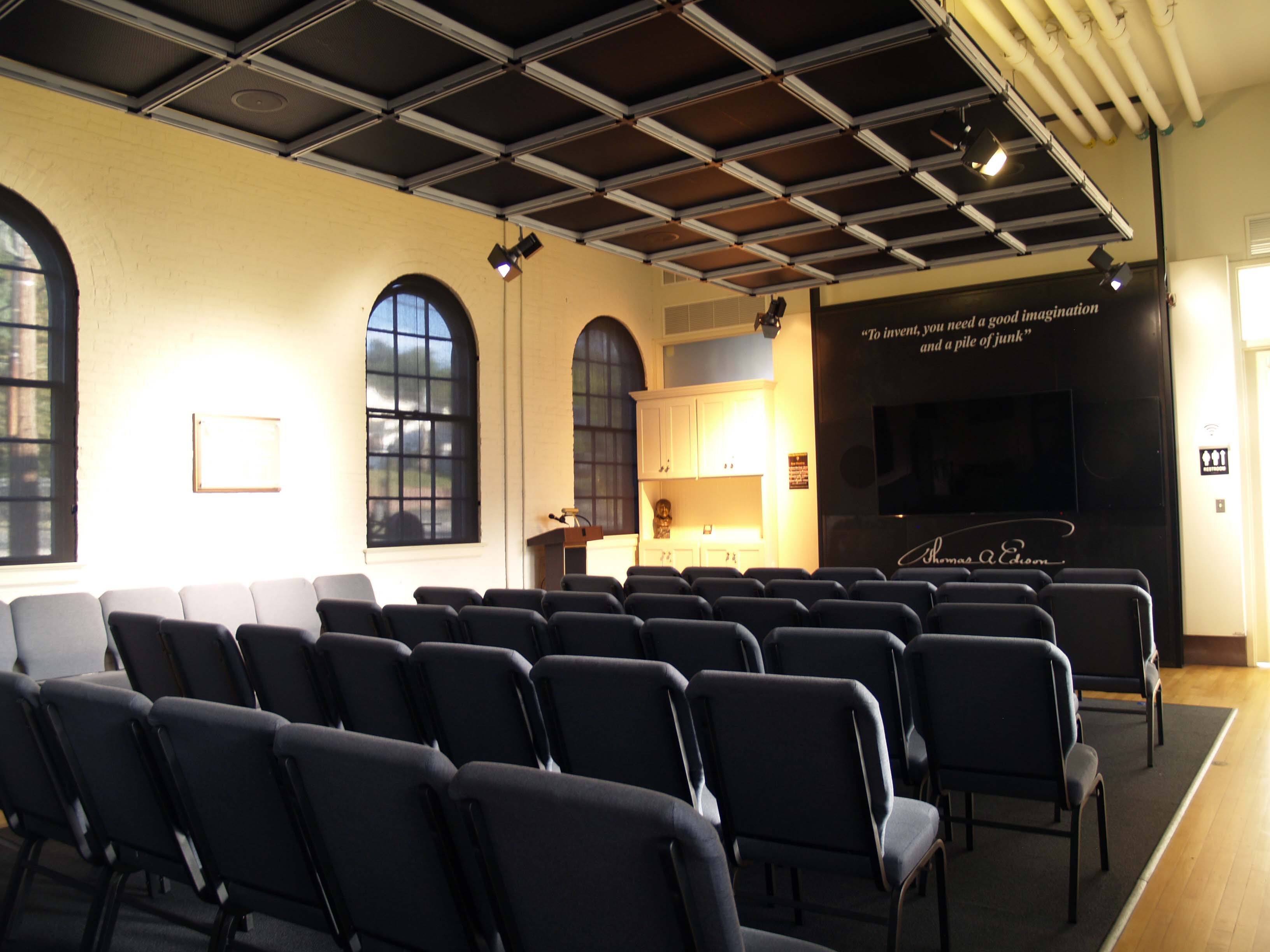 This is the visitor center theater.  In this picture are 45 blue padded chairs along with a 75 inch video monitor to show movies and to do lectures.