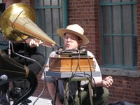 Sound Recording Curator prepares cylinder record for new recording.