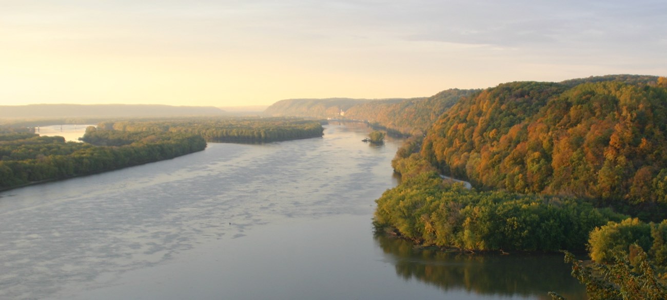 View from Fire Point overlook of sun rising over Mississippi River Valley