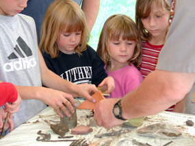 Kids at archeology day demonstration