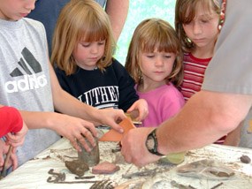 Kids at archeology day demonstration