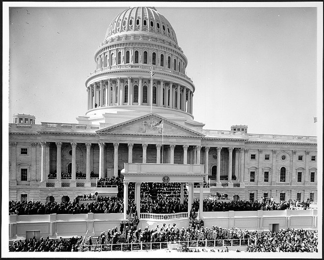 1961Inauguration LOC Hundreds gather on the stairs and portico of the large white domed US Capitol Building for the Inauguration of President John F. Kennedy