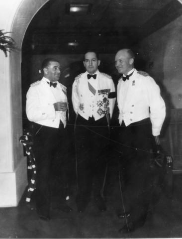 General Douglas MacArthur, Major Dwight D. Eisenhower, and Captain T.J. Davis are shown in formal dress at Malacanang Palace in Manila, The Philippines, 1935
