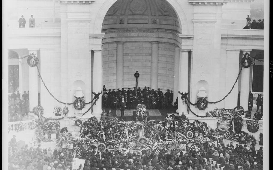 President Harding Stands at the Arlington Ampitheater Surrounded by Floral Arrangements