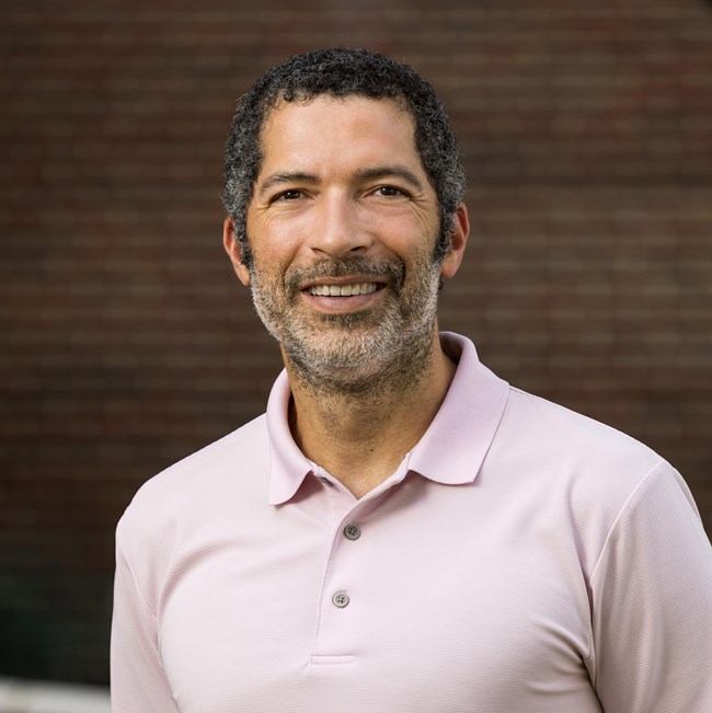 A portrait photograph of Dr. Matthew Delmont