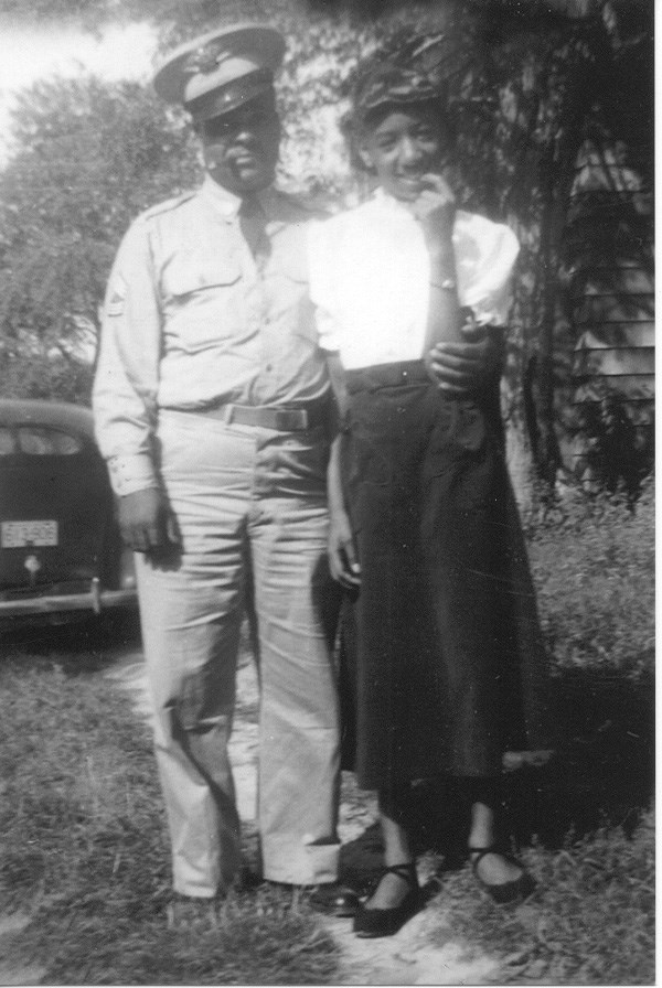 John Moaney, wearing his World War II Army uniform, stands next to an unidentified young woman