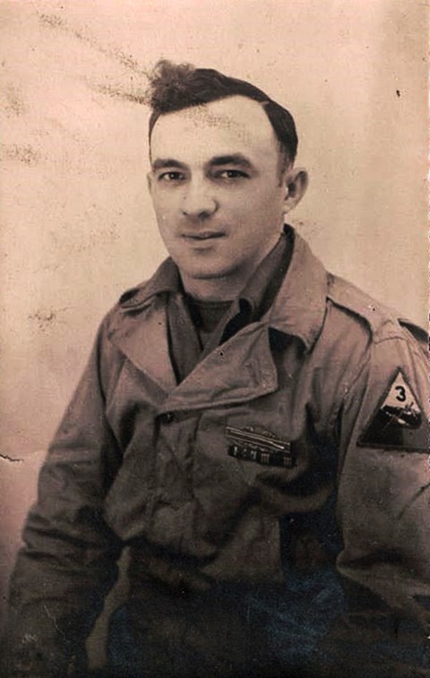 A black and white photo of John J. Tuskan, Sr. in his military uniform.