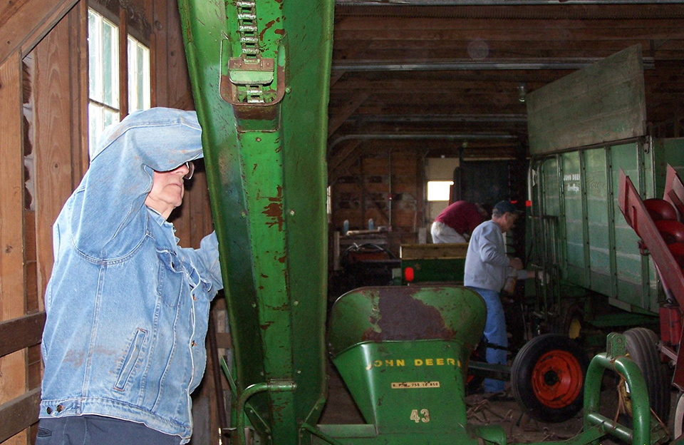 Volunteers help to clean and Ike's farm equipment and vehicles. Volunteers help to clean and Ike's farm equipment and vehicles.