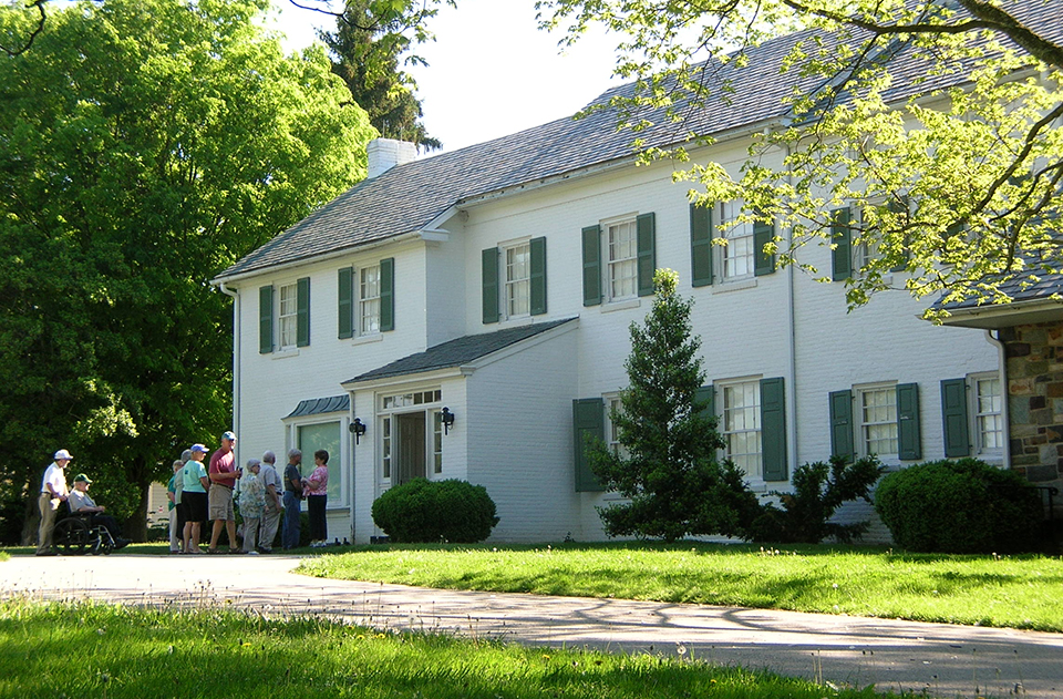 Visitors gather outside the front door of the Eisenhower home.