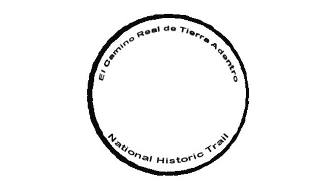 Trail name in black, small text, on the inside of a black circle.