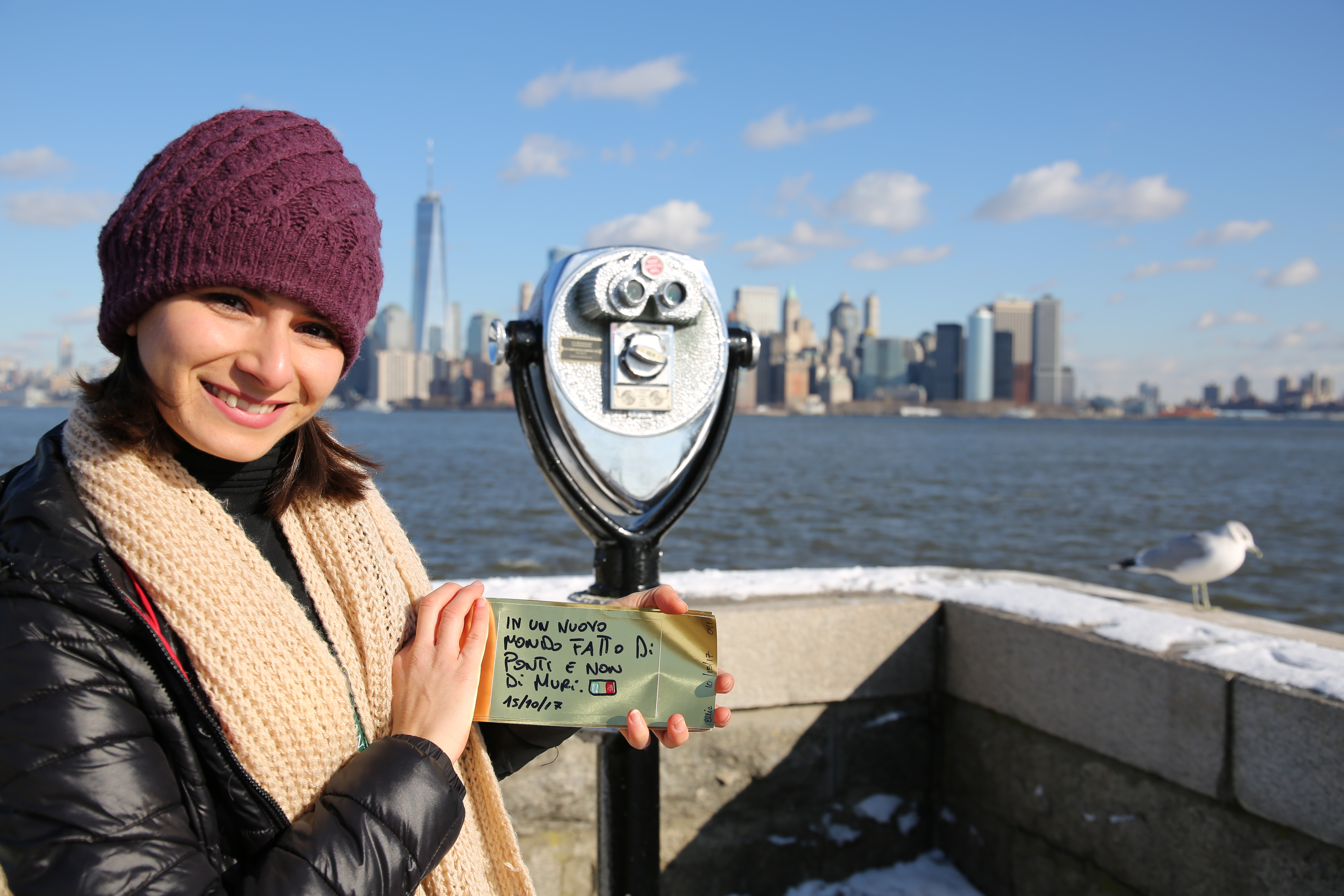 Italian visitor holding Gold brick with message in Italian.
