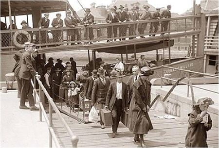 Arriving-at-Ellis Immigrants disembarking at Ellis Island