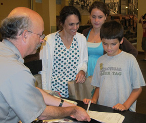 Jonathan, a 12 year old from Maryland, earns his Junior Ranger badge at Ellis Island Jonathan, a 12 year old from Maryland, earns his Junior Ranger badge at Ellis Island