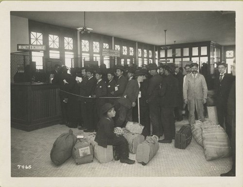 Immigrants Standing in the Railroad Ticketing Office