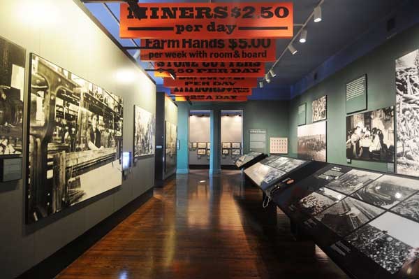 View of the "At Work In America" gallery within the Peak Immigration Years Exhibit.