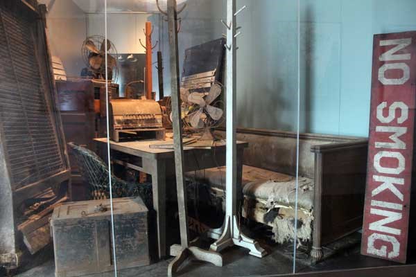Exhibit case containg objects from Ellis Island's period of abandonment.