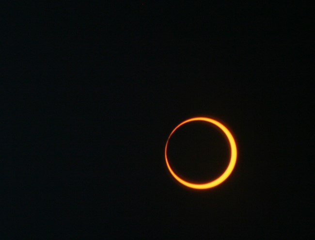 orange ring of Sun, mostly blocked by black moon