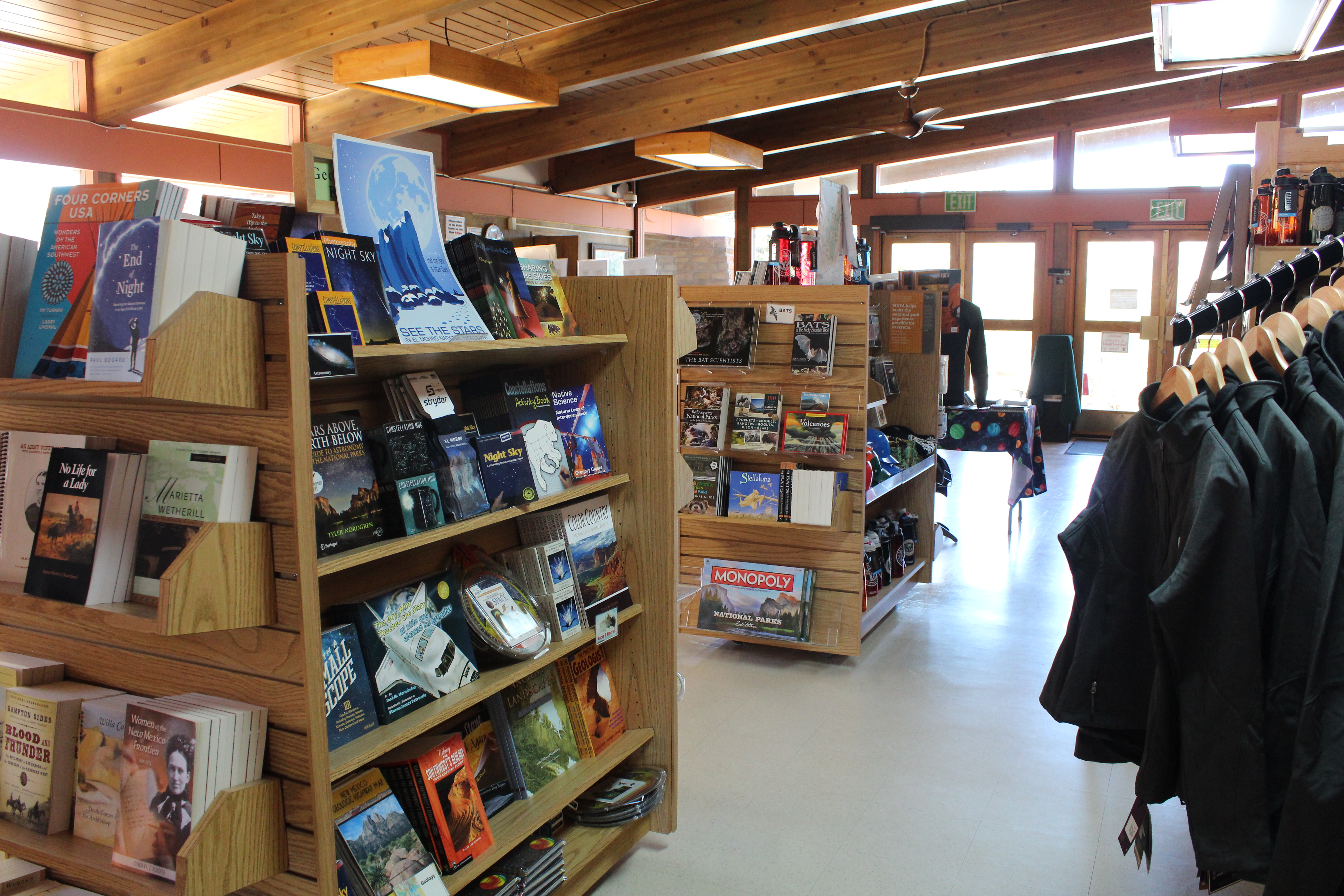 Books and other merchandise on bookshelves.
