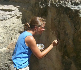 Image of a National Park Service conservator preserving an inscription