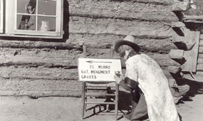 Image of a woman painting a directional sign during the 1930s. Image of a woman painting a directional sign during the 1930s.
