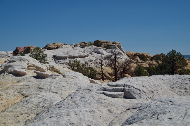 A trail over a bare rock surface